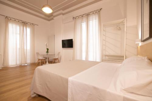 Кровать или кровати в номере Villareale47 Luxury Suites & Rooms