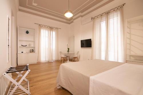 Кровать или кровати в номере Villareale47 Luxury Suites & Rooms