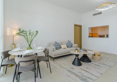 a living room with a table and a couch at Downtown Views 4702 in Dubai