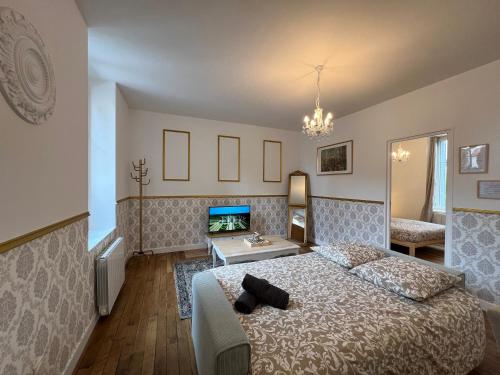 Ένα ή περισσότερα κρεβάτια σε δωμάτιο στο Le Renaissance - Home Homy