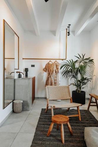 a living room with a bench and a table at Ikaros Suites in Amoudara Herakliou