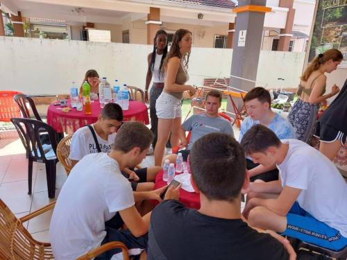a group of people sitting around a table at Greenleaf Angsana Homestay in Jerantut