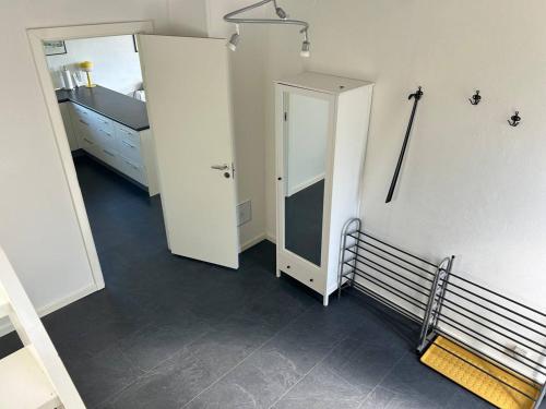 a room with a hallway with a door and a mirror at Kokhaven 23 in Rødekro