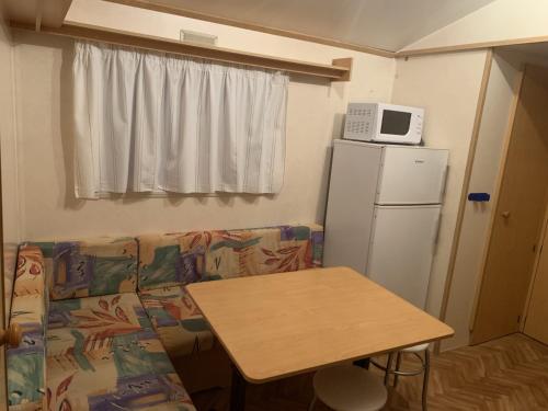Η κουζίνα ή μικρή κουζίνα στο Mobile home 4 saisons au Ranch du Bonheur