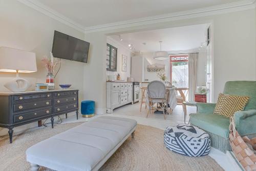 a living room with a couch and a table at Kirrin Cottage- Sheringham -Crabpot Cottages in Sheringham