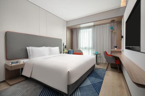 Postel nebo postele na pokoji v ubytování Holiday Inn Express Changfeng Park