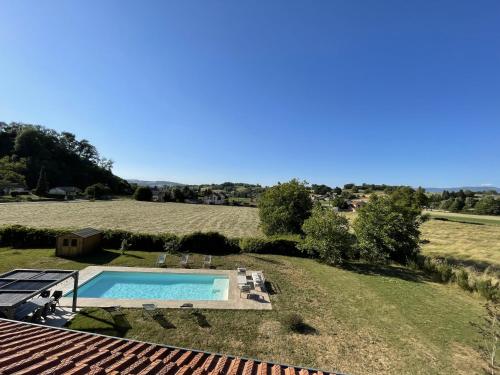 an overhead view of a swimming pool in a field at Gîte le clos Margherite 14 personnes piscine in Saint-Sorlin-de-Morestel