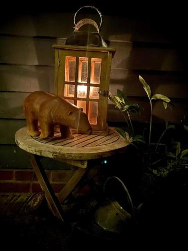 a light with a statue of an elephant on a table at Sissinghurst Stables in Cranbrook