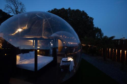 a bed in a dome tent at night at burbujas del sella in Ribadesella
