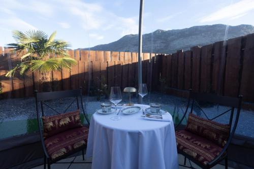 a table with a white table cloth on a patio at burbujas del sella in Ribadesella