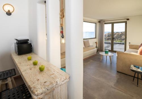 a living room with a table with apples on it at Casa di Mare Luxury Villas in Imerovigli
