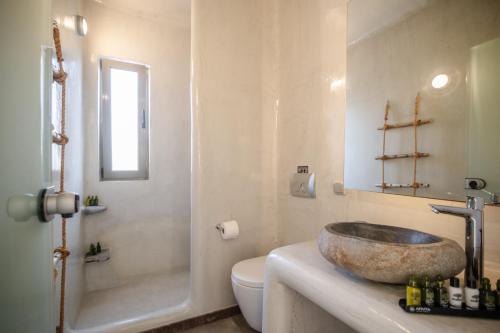 a bathroom with a sink and a toilet at Casa di Mare Luxury Villas in Imerovigli