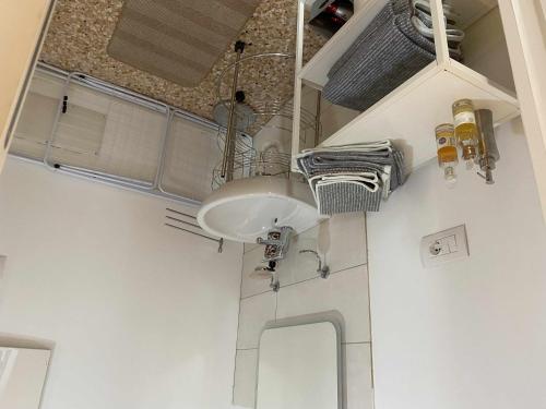 a bathroom with a white sink in a room at Palazzo Maggiore Suite A in Noale