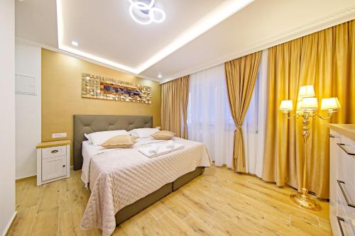 a bedroom with a large bed and a window at Private room Niko in Skradin