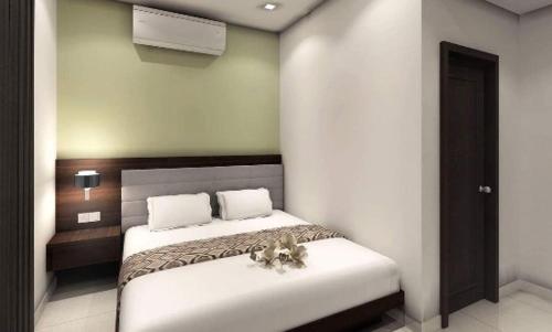 Un pat sau paturi într-o cameră la Manara Event