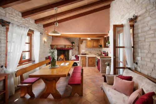 a kitchen and living room with a table and a couch at Ferienhaus Antonia Cittanova in Novigrad Istria