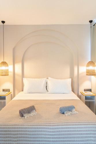 a bedroom with a bed with two towels on it at Villa Sorrento in Fethiye