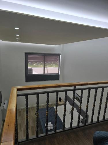 a staircase in a house with a window at Costa Del Sol in Durrës