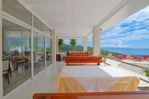 a bedroom with a bed and a view of the ocean at Seaview Bunec in Piqeras