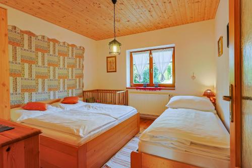 Posteľ alebo postele v izbe v ubytovaní Apartmány Anička ubytovanie region Liptovský Mikuláš