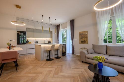 a living room with a couch and a kitchen at Jupiter Luxury Accommodation in Split