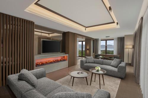 a living room with two couches and a fireplace at NG Enjoy in Sapanca