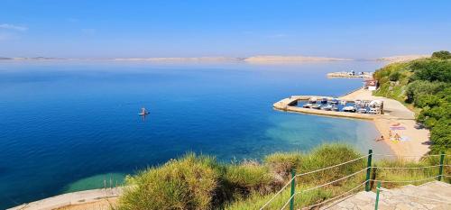 a view of a body of water with a boat in it at Apartments Nicolas - Beach & Sea 10m away - Amazing sea view! in Rtina