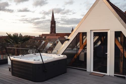 a hot tub on the roof of a building at Historical Luxury Homes - Exclusive Selection in Freiburg im Breisgau