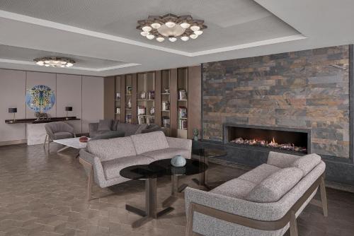 a living room with couches and a fireplace at NG Enjoy in Sapanca