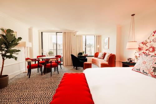 a hotel room with a bed and a red rug at The Leinster in Dublin