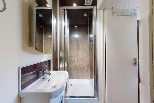 a bathroom with a sink and a shower at studio 69 in London