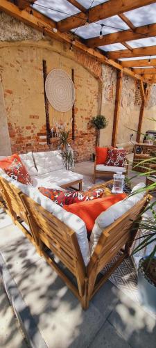 a large wooden bed sitting in a room at Glamping Tajemniczy Ogród in Strzelin