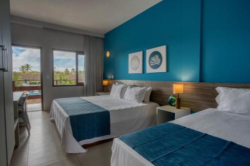 Postel nebo postele na pokoji v ubytování Tabaobí Smart Hotel