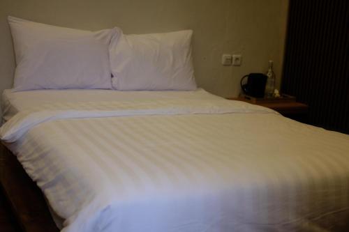 Кровать или кровати в номере Sora Boutique Stay