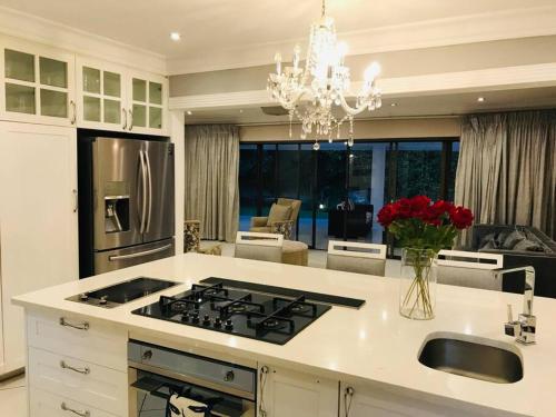 a kitchen with a stove and a counter top at The Garden of Eden in Johannesburg
