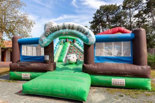 a water slide at a playground at maison cosy avec piscine, tennis, piste cyclable in Ondres