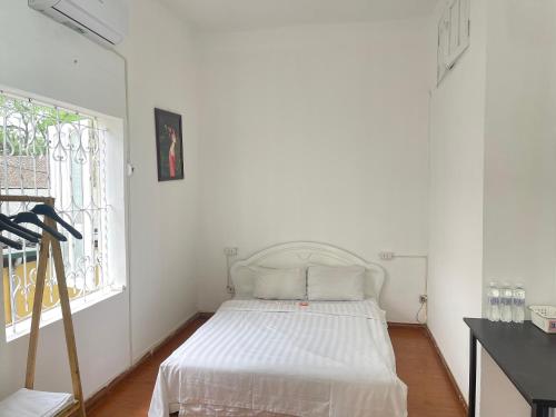 Кровать или кровати в номере Dorm Ha Noi Homestay Luxury