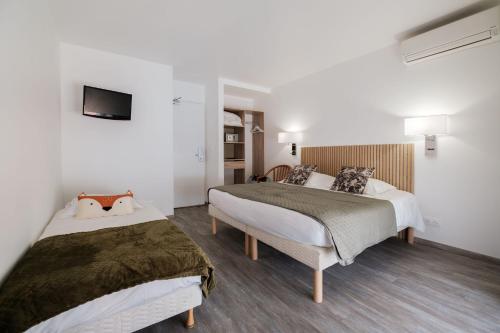 Letto o letti in una camera di Anglade Hotel