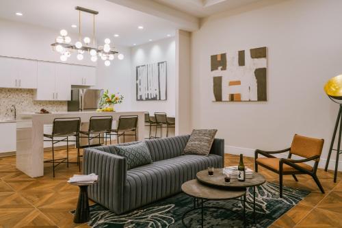 a living room with a couch and a kitchen at Sonder The Witherspoon in Philadelphia