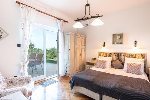 Posteľ alebo postele v izbe v ubytovaní Panoráma Villa Akarattya