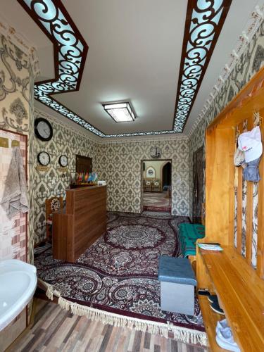 a bathroom with a bath tub and a sink at Khiva Rajab Ota in Khiva