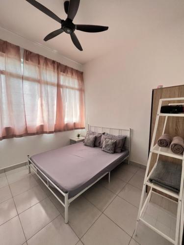 a bedroom with a bed and a ceiling fan at Condominium Seri Alam, Masai #ANhome in Masai