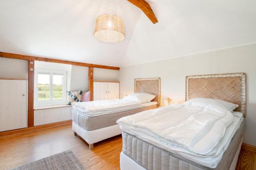 Voodi või voodid majutusasutuse Objekte im Umland Lübsche Mühle toas