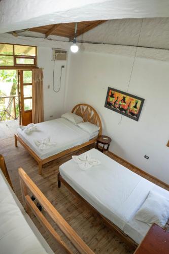 Postel nebo postele na pokoji v ubytování Bed and Breakfast Puerto López