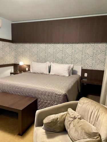 Ένα ή περισσότερα κρεβάτια σε δωμάτιο στο Locanda Hotel