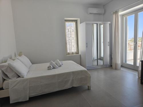 Ένα ή περισσότερα κρεβάτια σε δωμάτιο στο Paros Vista Residence