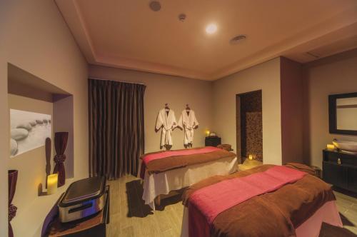 Un ou plusieurs lits dans un hébergement de l'établissement Riu Cancun - Adults Only - All Inclusive