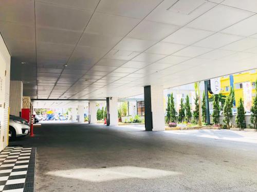 an empty parking garage with a car parked in it at Hotel Precia Naha Tsujimachi - Vacation STAY 17058v in Naha