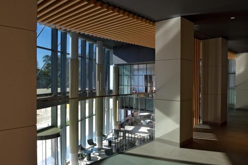a view of the lobby of a building with large windows at Novotel Lubumbashi in Lubumbashi