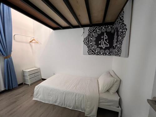 Postel nebo postele na pokoji v ubytování Damai Antara Homestay